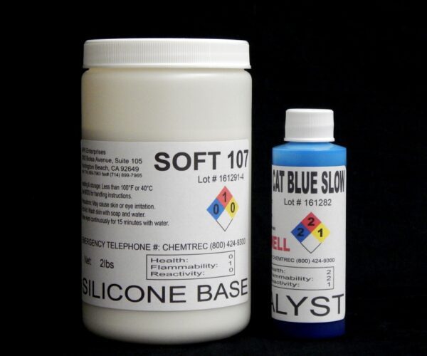 Two bottles labeled "2 lb Kit : Soft 107" and "cat blue slow catalyst" for silicone base products against a black background.