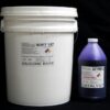 A large white bucket labeled "44 lb Kit : Soft 107" next to a smaller purple bottle with "cat purple catalyst" label, both against a black background.