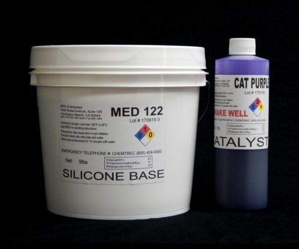 A white bucket labeled "10 lb Kit : Medium 122 silicone base" and a purple bottle labeled "cat purple catalyst" against a black background. both containers display hazard symbols and product details.