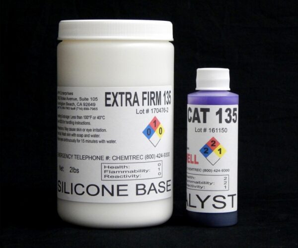 Two containers of chemicals labeled "2 lb Kit : Extra Firm 135 – (35 shore A durometer) – Regular Pot Life Mold Making Silicone" and "cat 135 catalyst" with hazard symbols, on a black background.