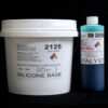 A white plastic bucket labeled "#2125 Base w/ MM Green Catalyst" and a blue cylindrical bottle labeled "10 lb Kit" against a black background.