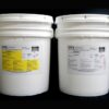 Two white industrial buckets with labels from mpk enterprises, one containing 80 lb Kit : MPK-1019 : 20 lb Rigid Pour Foam and the other polyol, against a black background.