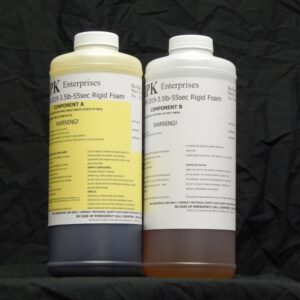 Two bottles labeled "4 lb Kit : MPK-1019 : 3.5 lb Rigid Pour Foam" for components a and b, each displaying warning labels and contact information.