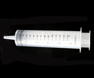 A clear syringe with numbers on it.