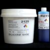 Two chemical containers: a white bucket labeled "10 lb Kit :#2125 Base w/ MM Blue Fast Catalyst – (25 shore A durometer)" and a blue bottle labeled "catalyst," both with hazard symbols and text details on a black background.