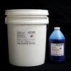 A white plastic bucket labeled "44 lb Kit : #2125 Base w/ MM Blue Fast Catalyst (25 shore A durometer)" next to a blue plastic bottle labeled "catalyst" against a black background.