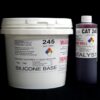 A white plastic bucket labeled "11 lb Kit : QM 245 : 45 shore A – Platinum Silicone" and a smaller purple-gray bottle labeled "catalyst" against a black background.