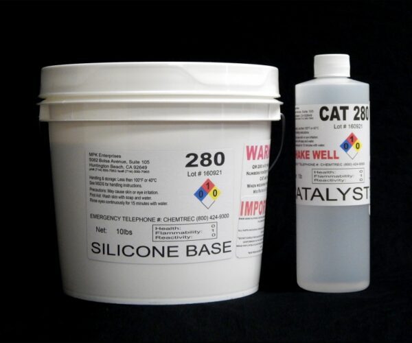 A white plastic bucket labeled "11 lb Kit : QM 280 : 80 shore A – Platinum Silicone" and a tube marked "catalyst" on a black background.