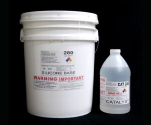 A 44 lb Kit of QM 280 - 80 shore A Platinum Silicone labeled "silicone base" next to a smaller white bottle labeled "catalyst" on a black background.