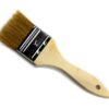 A wooden brush with a black handle and white tip.