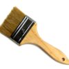 A wooden brush with a black handle