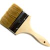 A wooden brush with brown bristles on top of it.