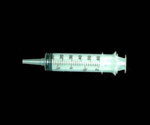 A syringe with numbers on it is shown.