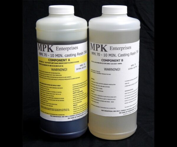 Two bottles labeled "4 lb Kit : MPK-70 : 10 Min Polyurethane Casting Resin" with warning labels, one marked component a and the other component b.