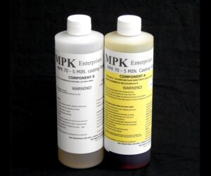 Two bottles labeled 2 lb Kit : MPK-70 : 5 Min Polyurethane Casting Resin, component a and b, against a black background.