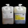 Two large plastic jerrycans with dispensing pumps, one white and one gray, labeled with chemical information from 80 lb Kit : MPK-70 : 5 Min Polyurethane Casting Resin from mpk enterprises.