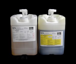 Two large plastic jerrycans with dispensing pumps, one white and one gray, labeled with chemical information from 80 lb Kit : MPK-70 : 5 Min Polyurethane Casting Resin from mpk enterprises.