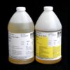 Two labeled 8 lb Kit : MPK-90 : Hi Impact 3 Min. Polyurethane Casting Resin containers, one partially filled with a translucent yellow liquid and the other similarly filled but clearer, against a black background.