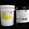 Two DF10lb NATURAL Pail Kits, one white and one black, with labels, against a black background.