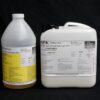 Two large DF10lb NATURAL Gallon Kit containers with labels, one white and one yellow, against a black background.