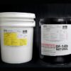 Two DF14lb NATURAL Pail Kits against a black background; one white and unmarked, the other black with detailed chemical labels.