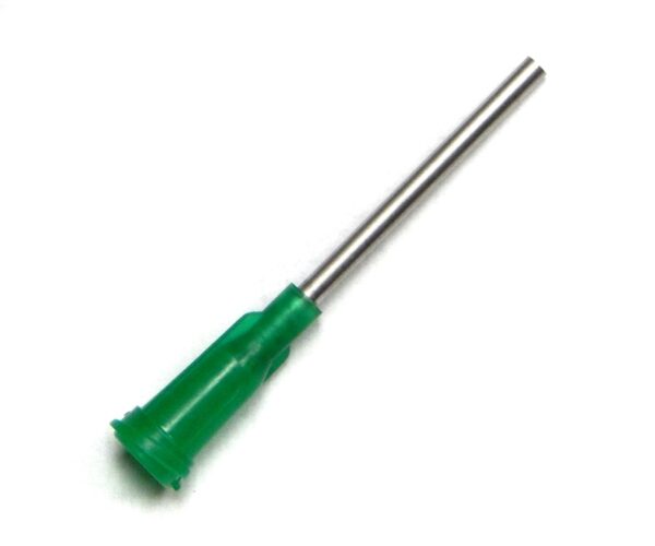 A green screwdriver is on the white surface.