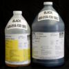 Two large industrial containers labeled "1 Gallon Kit MPK 400-81A-100sec BLACK," one opaque white and one translucent gray, detailed with yellow and white text, against a black background.