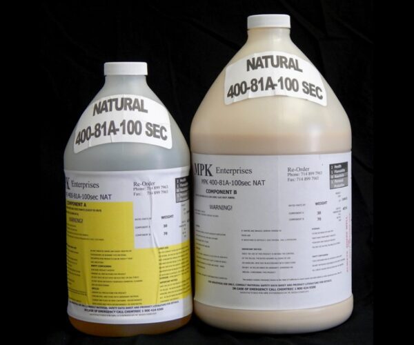 Two large industrial chemical containers labeled "1 Gallon Kit MPK 400-81A-100sec NATURAL" on a black background.