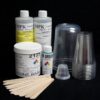 Assorted SILICONE 2125 / RESIN Starter Kit with SUPPLIES including bottles of components, mixing cups, and wooden stirrers on a black background.