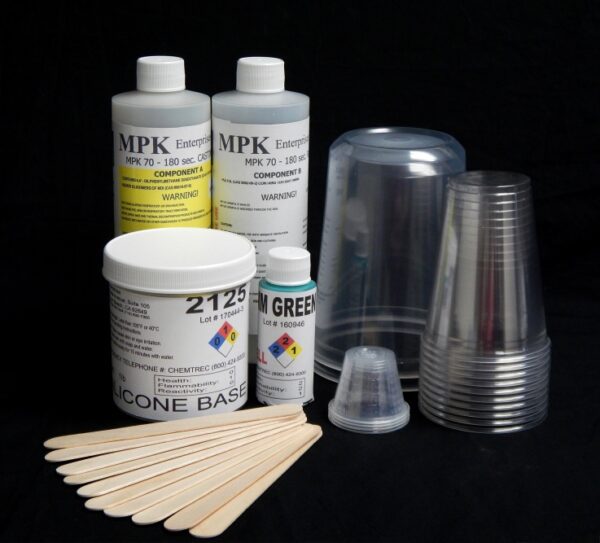 Assorted SILICONE 2125 / RESIN Starter Kit with SUPPLIES including bottles of components, mixing cups, and wooden stirrers on a black background.