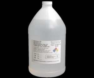 White plastic jug containing 8 lb/ 128 oz lb Kit Silicone Fluid labeled with safety and company information, including hazard symbols.