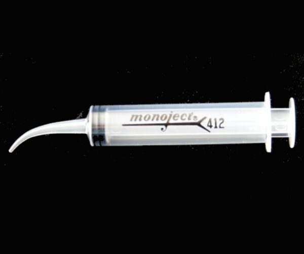 A clear syringe with a black writing on it.