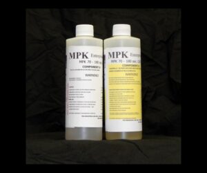 Two bottles labeled "2 lb Kit : MPK-70 -180" against a black background, with text detailing product components and warnings.