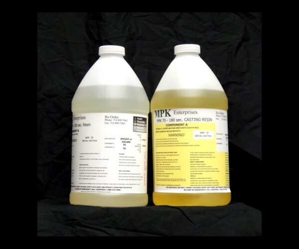 Two jugs of 8 lb Kit : MPK-70 : 180 Sec 2 Part Polyurethane Casting Resin labeled mpk enterprises, one with a white label and the other with a yellow label, against a black background.