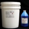 A white bucket labeled "44 lb Kit : Medium 122 FG Cat Blue" and a blue bottle labeled "(22 shore A durometer) – Food Grade Mold Making Silicone" on a black background.