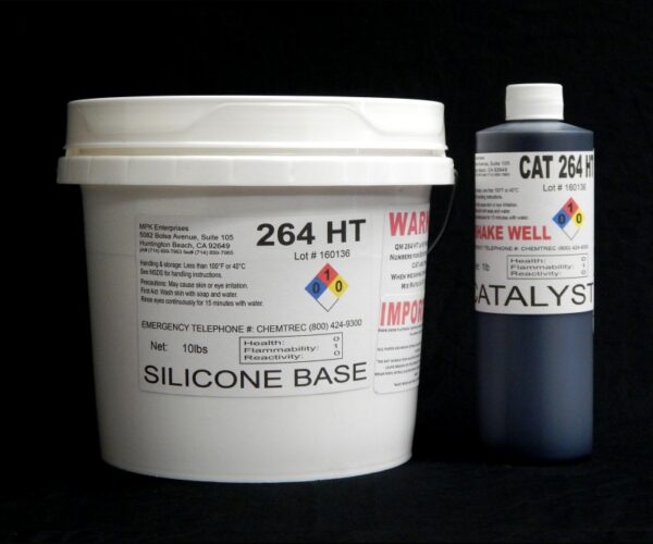 A white plastic bucket labeled "11 lb Kit : QM 264HT : 60 shore A – Platinum Silicone – High Temp" and a black cylindrical container marked "catalyst" against a black background.